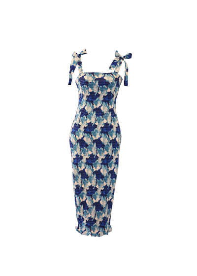 A shirred bodycon dress with tie up straps. A midi length dress with a blue floral pattern.